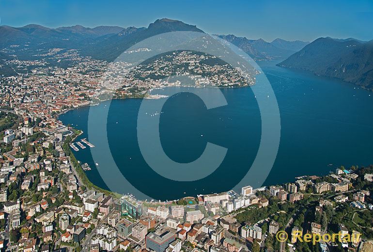 Foto: Eine Seebucht ist zugebaut - Lugano (TI). (Luftaufnahme von Niklaus Wächter)